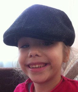 Polina wearing her dad's hat during a recent trip to Russia that her parents took to see her and attend court sessions. What a cutie! 