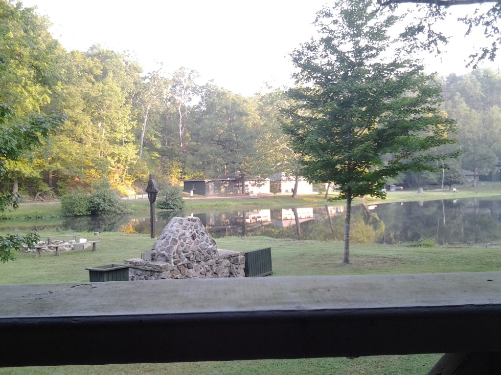 The view behind our cabin. Beautiful lake, cross and grounds. 