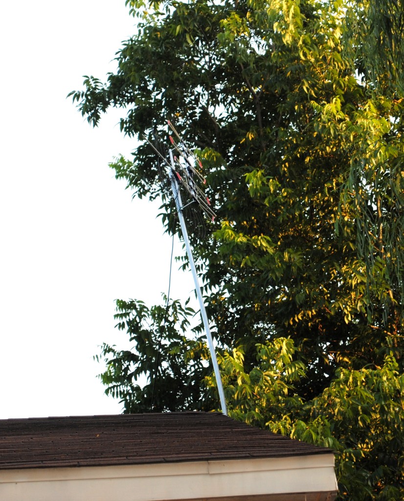 In case you can't tell, that's our antenna we bought when we moved to Elkins. It got damaged in last week's storm (that's why it's leaning funny). By not having cable we are able to save lots of money each month that we put towards paying more important bills. 