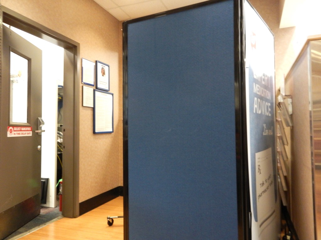 This non-descript blue partition is where you go behind to receive the shot. It protects your privacy!