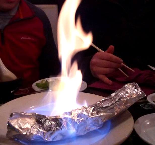 Not all sushi is raw. In fact, many rolls are not. This is the Flaming Volcano from Sushi House. It has raw meat and spices in the foil and they light it on fire at the table. That of course cooks the meat. So delicious! 