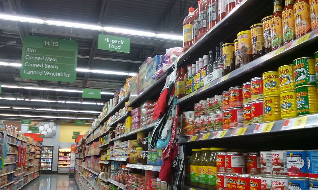 The diced jalapenos were in the general Mexican food aisle. I first grabbed the ones you use for nachos then found the diced ones in the area where you get enchilada ingredients. I got canned jalapenos but should have bought a jar so I could use a lid for the remaining peppers. 