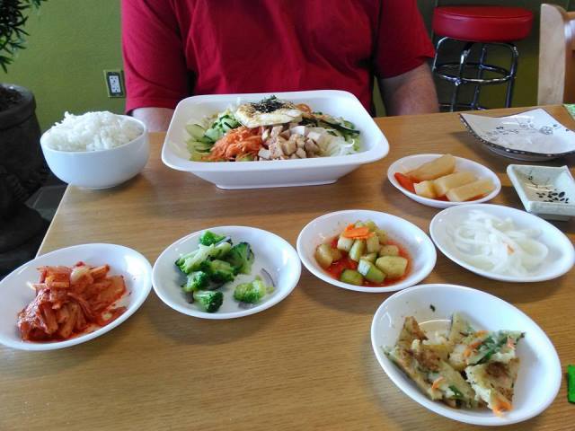 They bring all the components of the bibimbap in separate little dishes so the person can blend it themselves. 