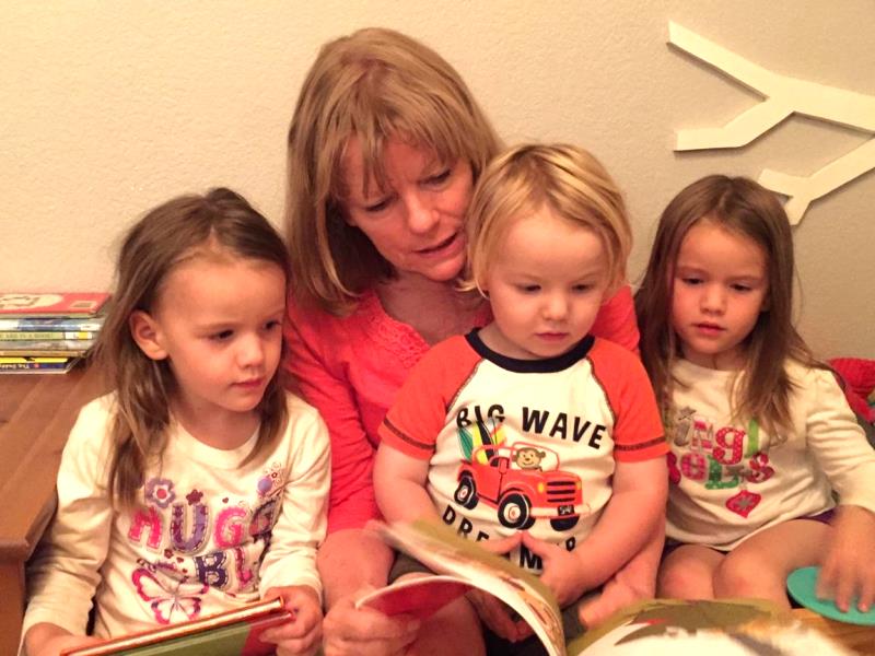 My mom reading to her three grandkids. My twin nieces and nephew love being read to! I don't get to see them nearly enough but I love picking out books to send them. I'm using my codes from Kellogg's to get books for them. 