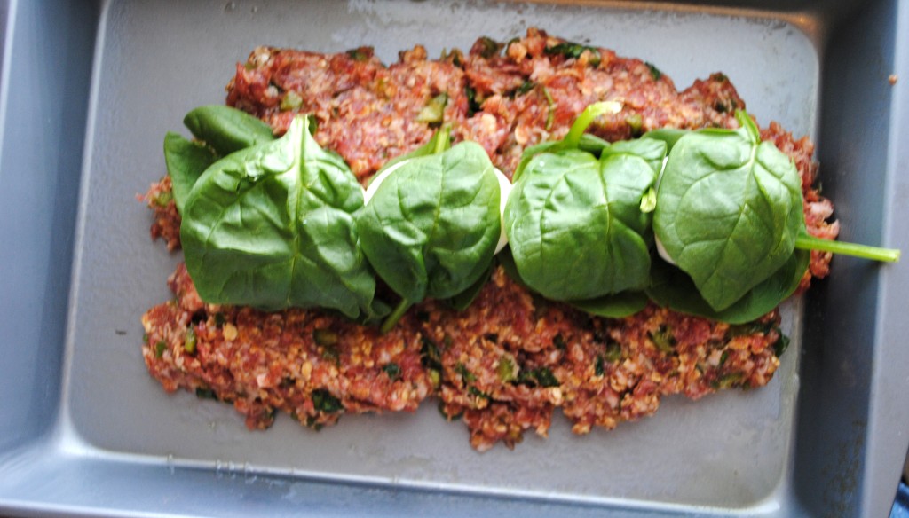 The four eggs laid end to end and wrapped in spinach. 