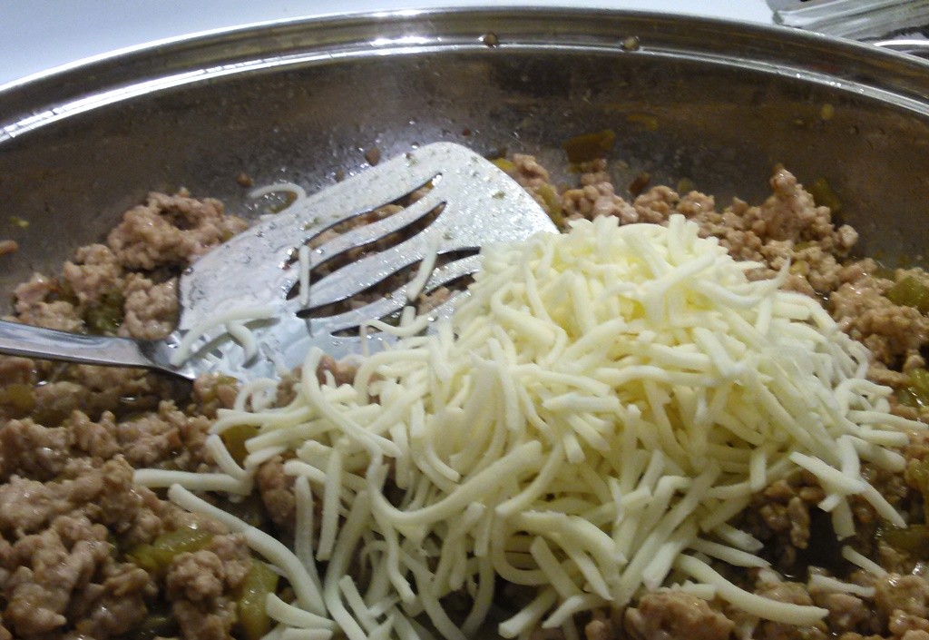 Add in about a cup and a half of Kraft mozzarella shredded cheese to complete your mix. 