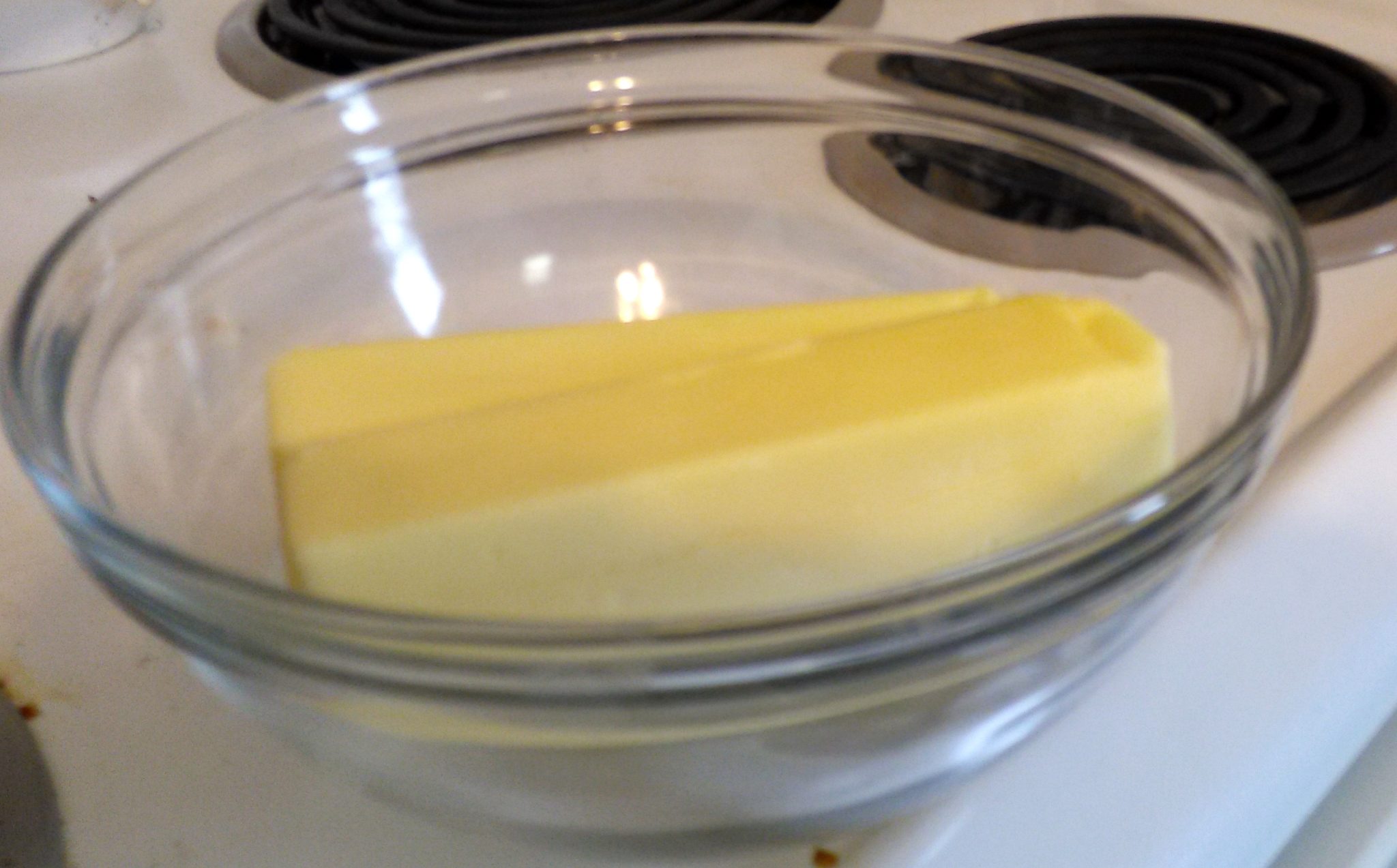 Tip: I put both sticks of butter straight from the refrigerator in a glass bowl. I placed the bowl on top of the stove so the heat from the oven below would slightly warm it to room temperature. 