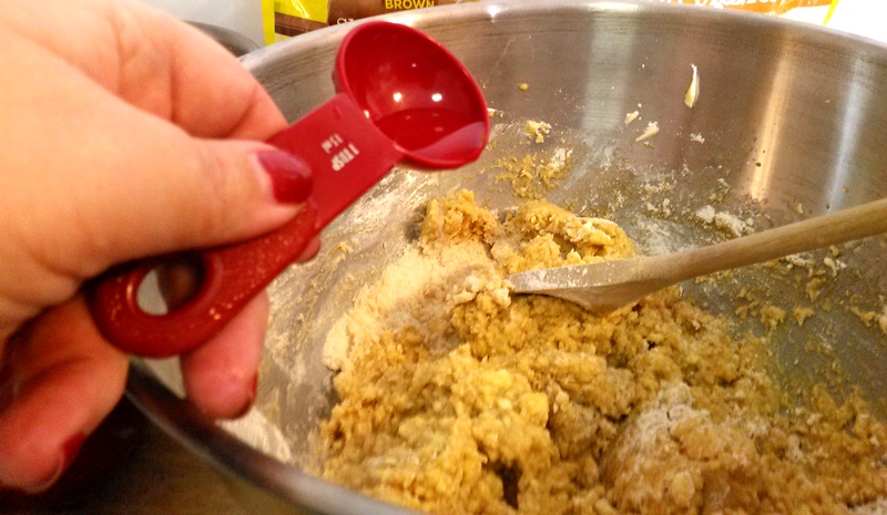 Add a tablespoon of water with the first half of the dry ingredients being mixed with the wet ingredients. Do the same with the second tablespoon and second half of the dry ingredients. 