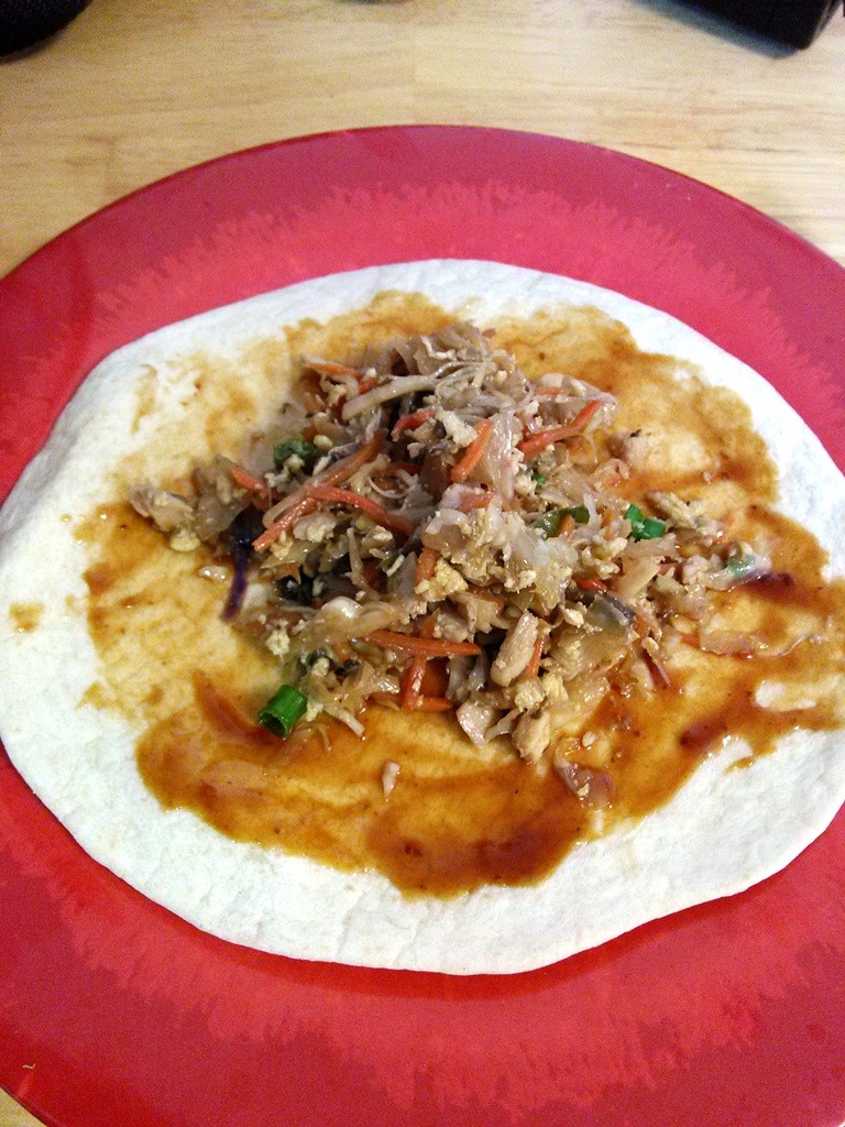 Place the desired amount of moo shu mix in the middle of the tortilla. 