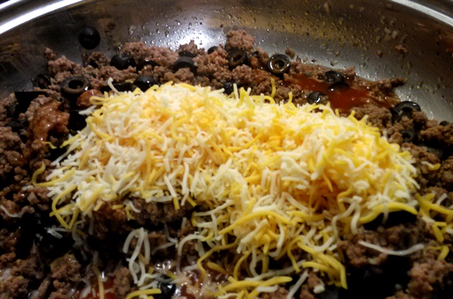 Mix in about 1 cup of the finely shredded cheese. I prefer finely shredded because to me it creates less grease. But using regular shredded cheese is totally acceptable. 