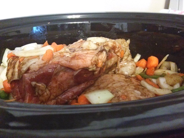 Place the veggie mix under and around the tri-tip in the slow cooker. 
