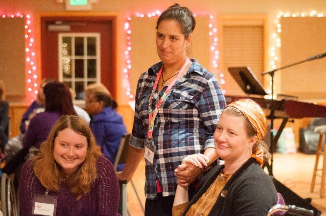 Melissa, right, her friend Vanessa and daughter Shelley at a retreat in October 2015, two months after the initial crash. She had to use a wheelchair most of the weekend. 