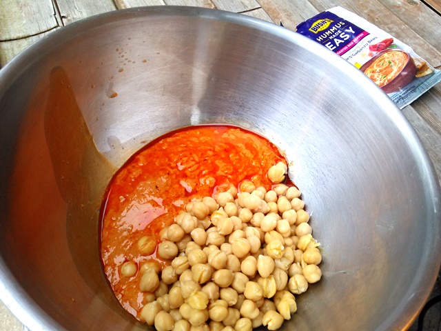 Place the Hummus Made Easy and the beans (drained but not rinsed) together in a bowl. 