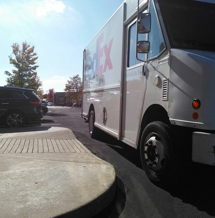 FedEx truck blocking a wheelchair ramp